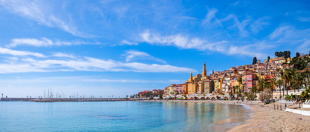 Colorful buildings overlook the sea in Menton, a famous seaside resort on the French Riviera (3 shots stitched)