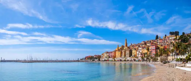 Colorful buildings overlook the sea in Menton, a famous seaside resort on the French Riviera (3 shots stitched)