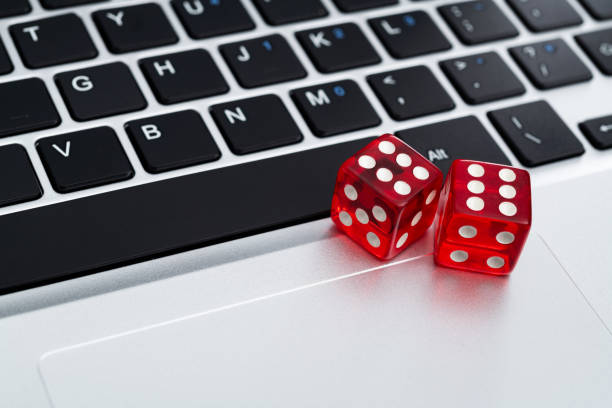 istock Red dices on laptop keyboard 1423255489