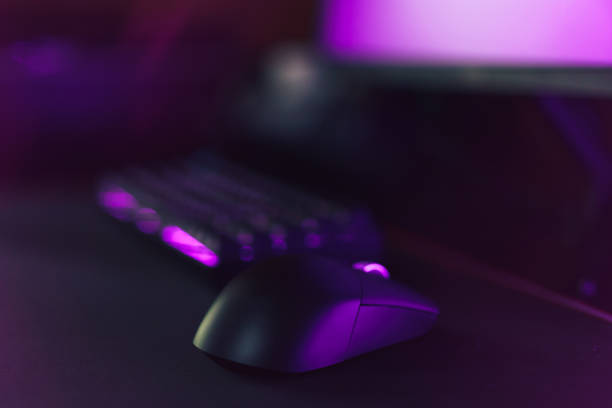 istock Gaming accessories on neon purple background 1423256114