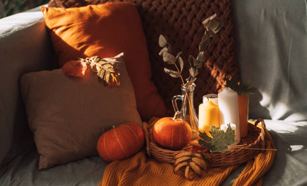 istock Autumn interior with burning candles and pumpkin 1423256722