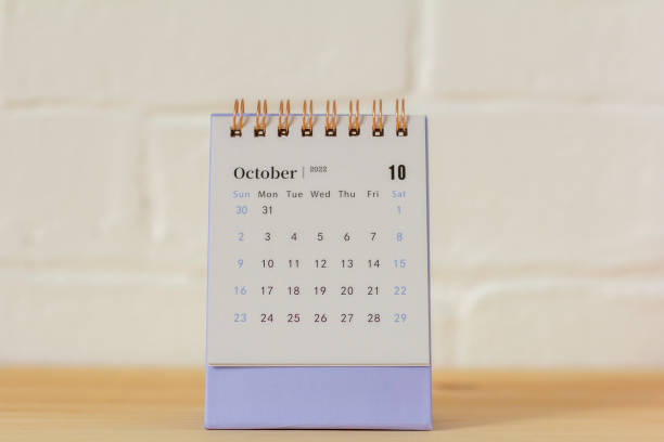 istock Hello October.Desktop calendar for October 2022 on the table. 1423258208