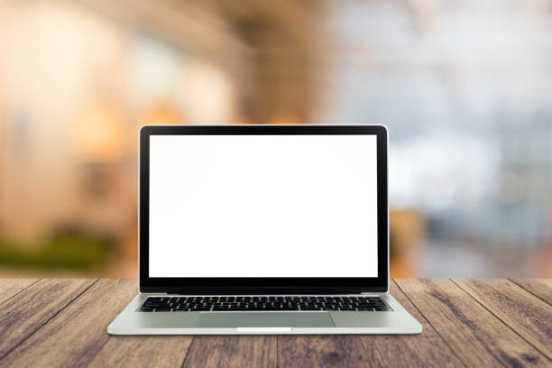 istock Computer mockup white background on wooden table. Laptop with blank screen 1423260079