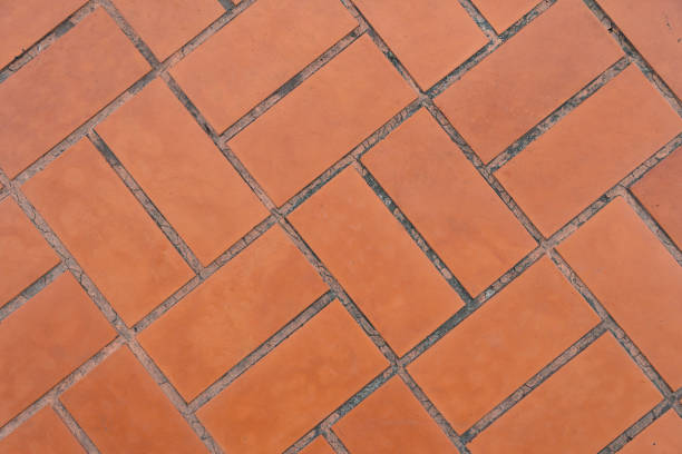 istock smooth concrete floor Brown floor forming a square, used for paved walkways, dust and soil covered on the surface according to the conditions of use. 1423260800