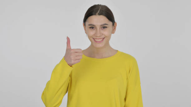 istock Spanish Woman showing Thumbs Up on White Background 1423262670
