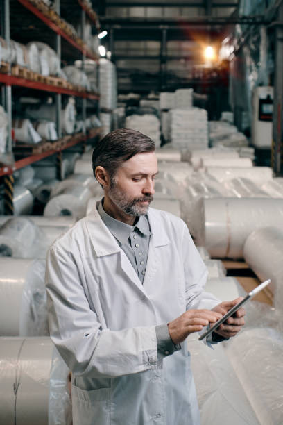 istock Man at factory with tablet 1423262900