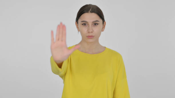 istock Stopping Spanish Woman on White Background 1423264675