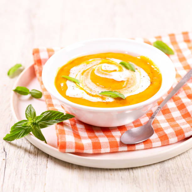 istock pumpkin soup with cream and basil 1423266512