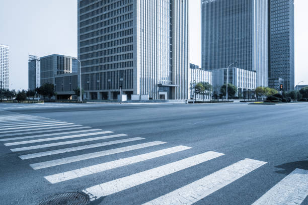 istock empty road with zebra crossing and skyscrapers in modern city 1423270956