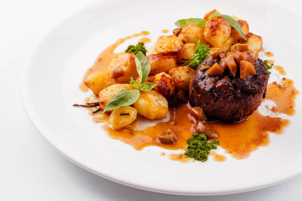 istock Delicious grilled beef medallion with fried potatoes 1423271087