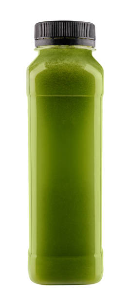 Bottle of spirulina smoothie on white background stock photo