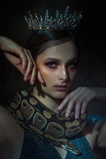 Fantasy portrait of beautiful woman with snake