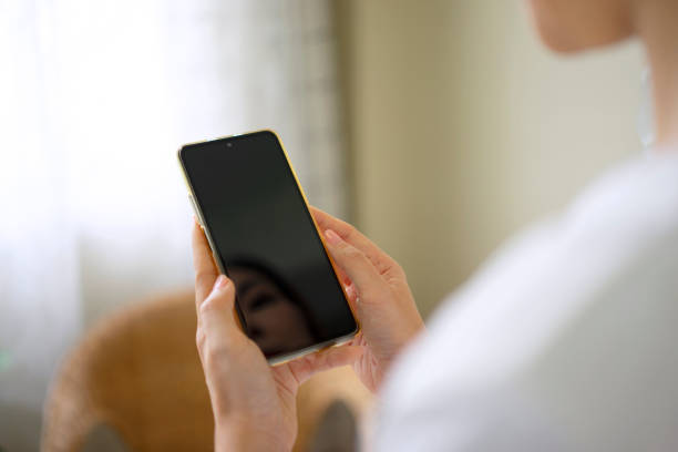 istock Woman is using a digital device for electronic banking at home. 1423275693