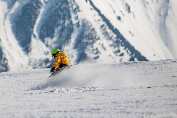 istock School age boy skiing in mountains 1423276001