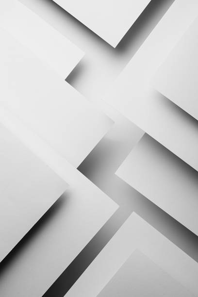 istock White abstract geometric background with fly white surfaces as monochrome stylish pattern with triangles, corners, inclined stripes, lines and shadows in elegant simple modern minimal style, vertical. 1423276024