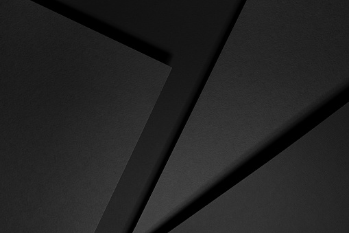 Dark grey abstract geometric background with soar rectangle spaces, stripes, lines, corners in hard light with black shadows in simple strict modern style for business card, poster, flyer, top view.