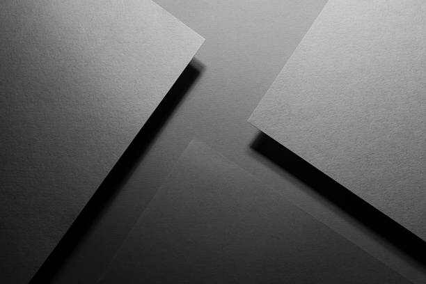 istock Carbon grey abstract geometric background with fly rectangle surfaces, stripes, corners, lines in hard light, shadows in rich minimal business style for card, poster, flyer, text, top view. 1423276109