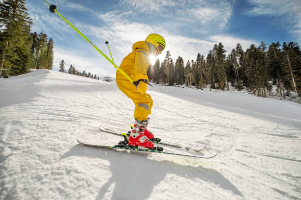 istock School age boy skiing in mountains 1423276159