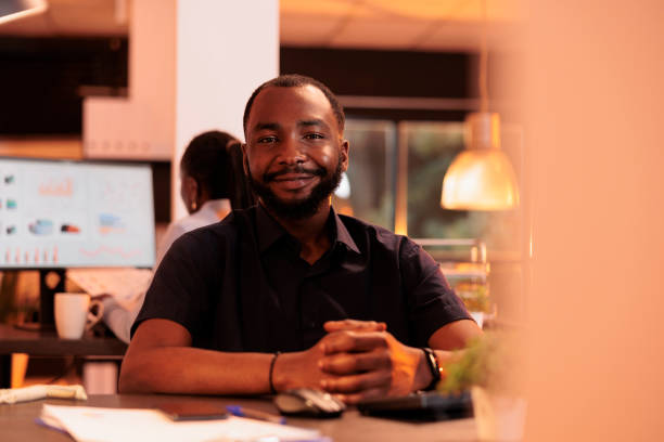 istock Portrait of young businessman doing paperwork research 1423276607