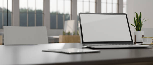 istock close-up, Workspace in a modern co-working space with laptop mockup on the table 1423278175