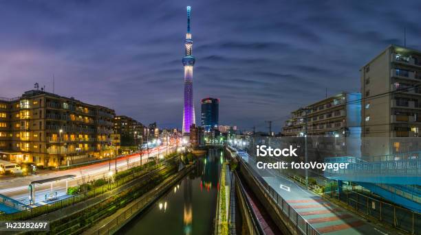 Tokyo Skytree Illuminated At Night Overlooking Canals Apartments Panorama Japan Stock Photo - Download Image Now