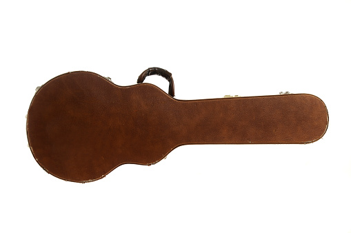 Brown leather guitar case isolated on a whit background