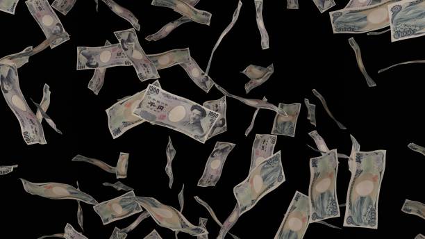 istock 1000 Japanese Yen bills falling down. Banknotes isolated on black background. 1423284607