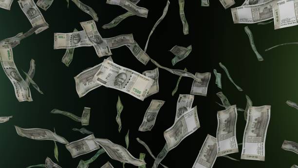 istock 500 Indian Rupee bills falling down. Banknotes. Money rain. 1423285009