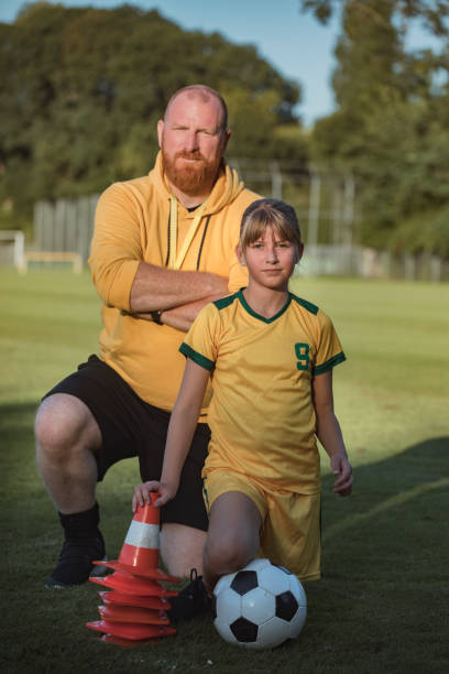istock Soccer father and daughter resting during a coaching session 1423286701