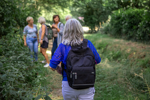 Portrait of a senior woman hiking outdoors on an outdoor adventure