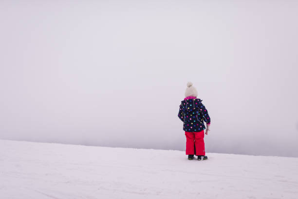 istock Beautiful smiling girl on winter day 1423293044