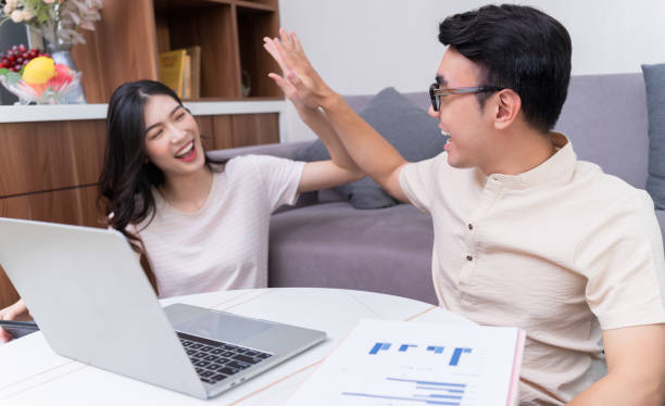 istock Young Asian couple at home 1423295020