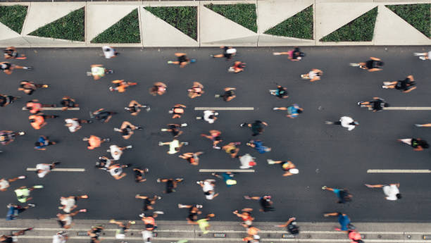 istock Aerial view of people running 1423295595