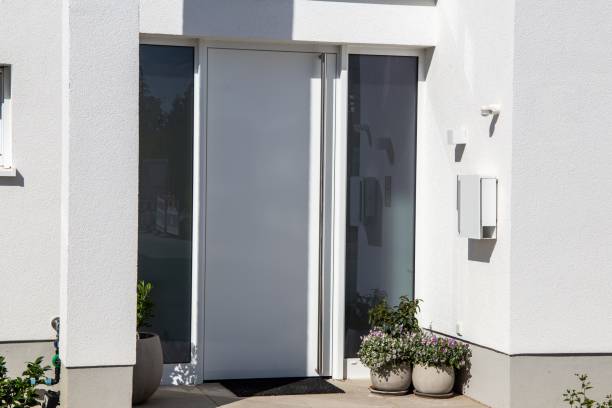 istock Modern white front door on a residential home 1423295860