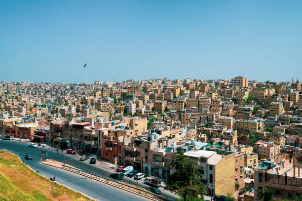 Amman skyline in Jordan. Sunny day view of the old downtown of Jordanian capital city built on seven hills from a high altitude on a clear sunny day
