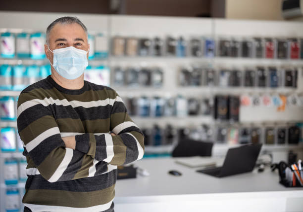 istock Small shop owner looking at camera 1423303779