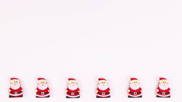 istock Santa Clous stickers on bottom side on white copy space background. Flat lay 1423305222
