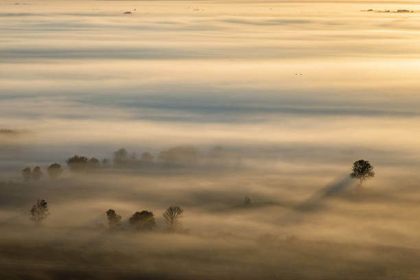 istock Landscape view in a misty sunrise 1423306252