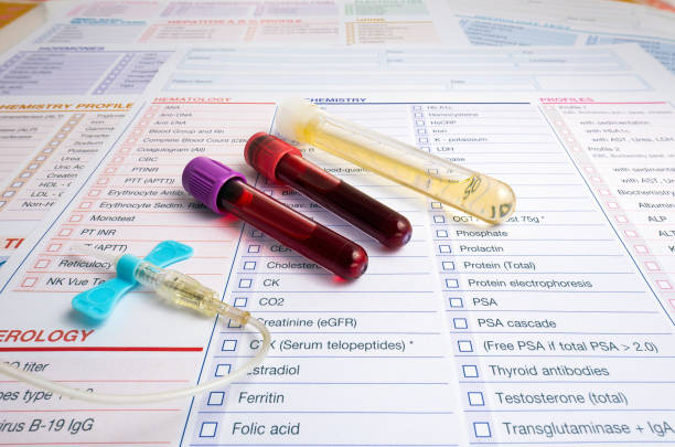 blood sample and urine collection tubes and supplies with requisition form for analysis in the clinical laboratory stock photo