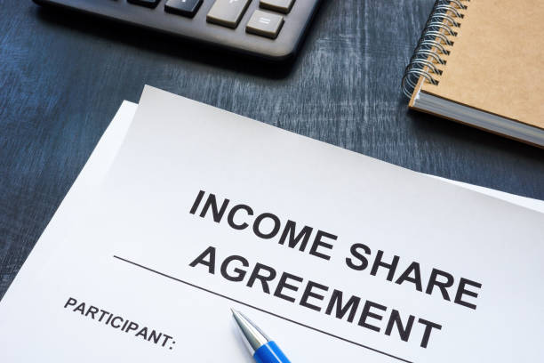 istock Income share agreement near notepad on the desk. 1423311850