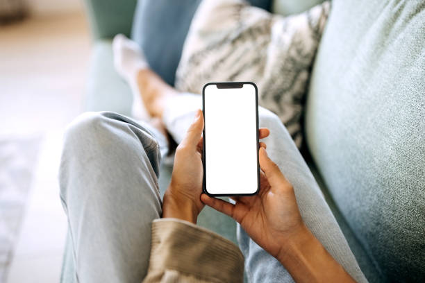 Unrecognisable woman holding smart phone with white screen