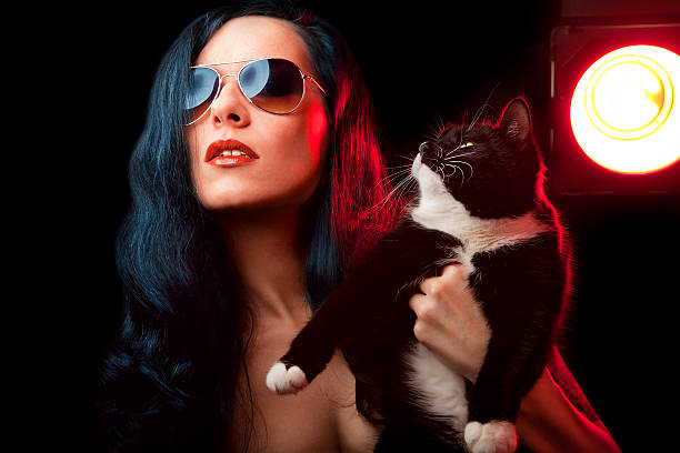 istock beautiful woman with cat 142331404