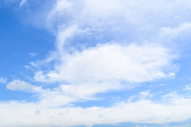 White clouds in the bright blue sky. The beauty of the nature