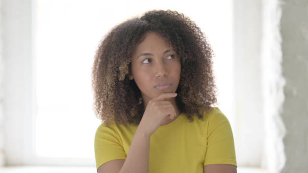 istock Thinking African Woman Getting New Idea 1423319882