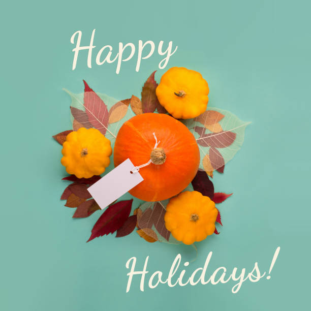 istock Happy Holidays Autumn Card with Pumpkins on Mint Background. 1423320425