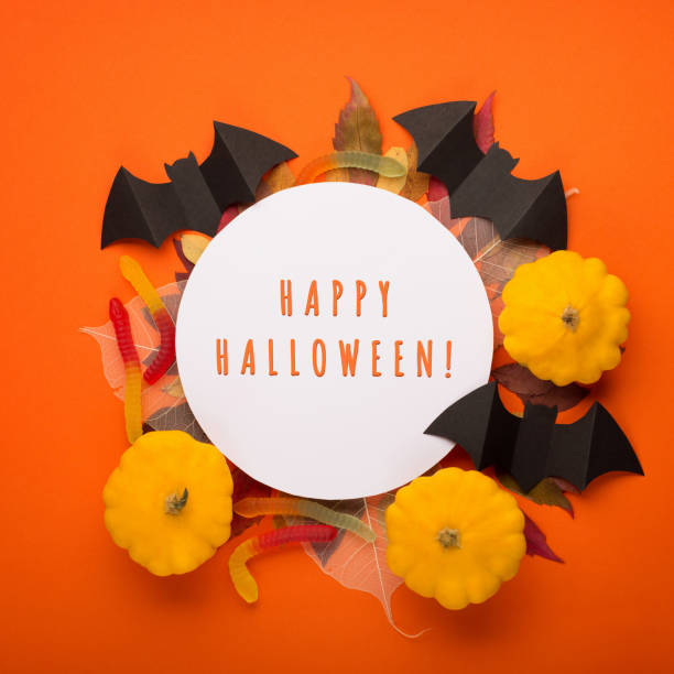 istock Autumn Halloween floral composition with orange pumpkins. 1423320442