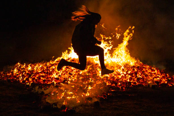 Summer solstice celebration jumping into the fire. Burning flames Summer solstice celebration jumping into the fire. Burning flames. Danger san juan stock pictures, royalty-free photos & images