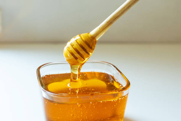 istock Honey and honey dipper 1423323817