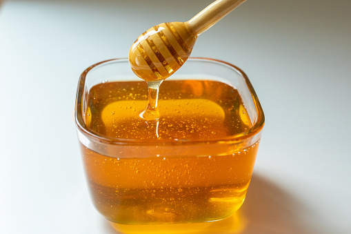 Honey and honey dipper