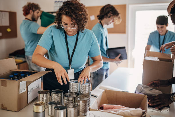 istock Volunteers in charity center 1423323946